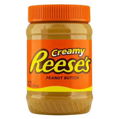 An orange and clear plastic container of Reese's creamy peanut butter